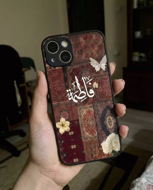 Persian phone case with pressed white flowers and butterflies on vintage rug background lifestyle shot