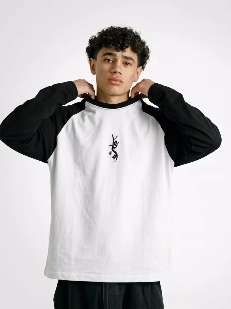 Minimal Islamic streetwear raglan featuring Arabic Ali embroidery