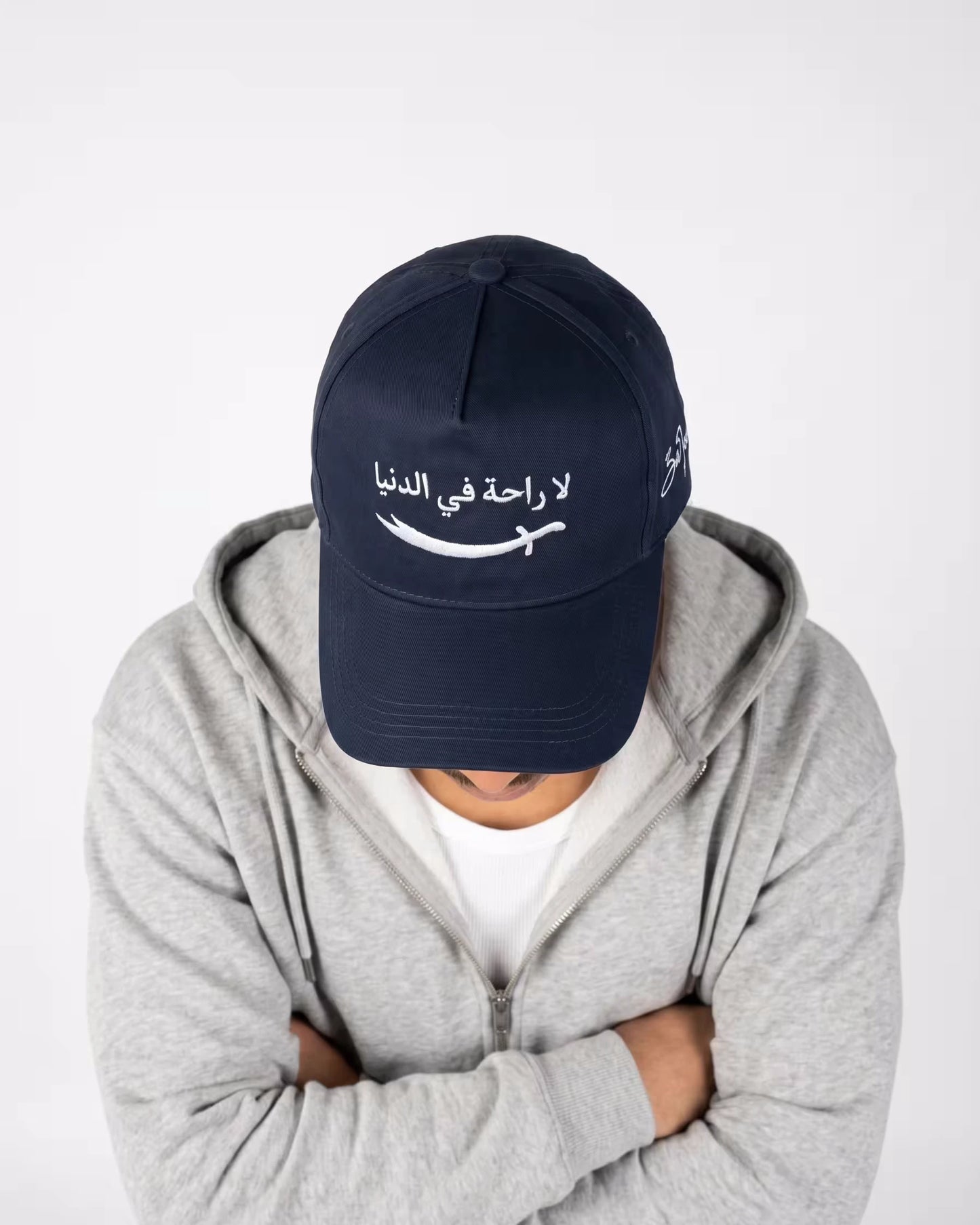 Man wearing navy Zulfiqar cap - Islamic cap for men streetwear style